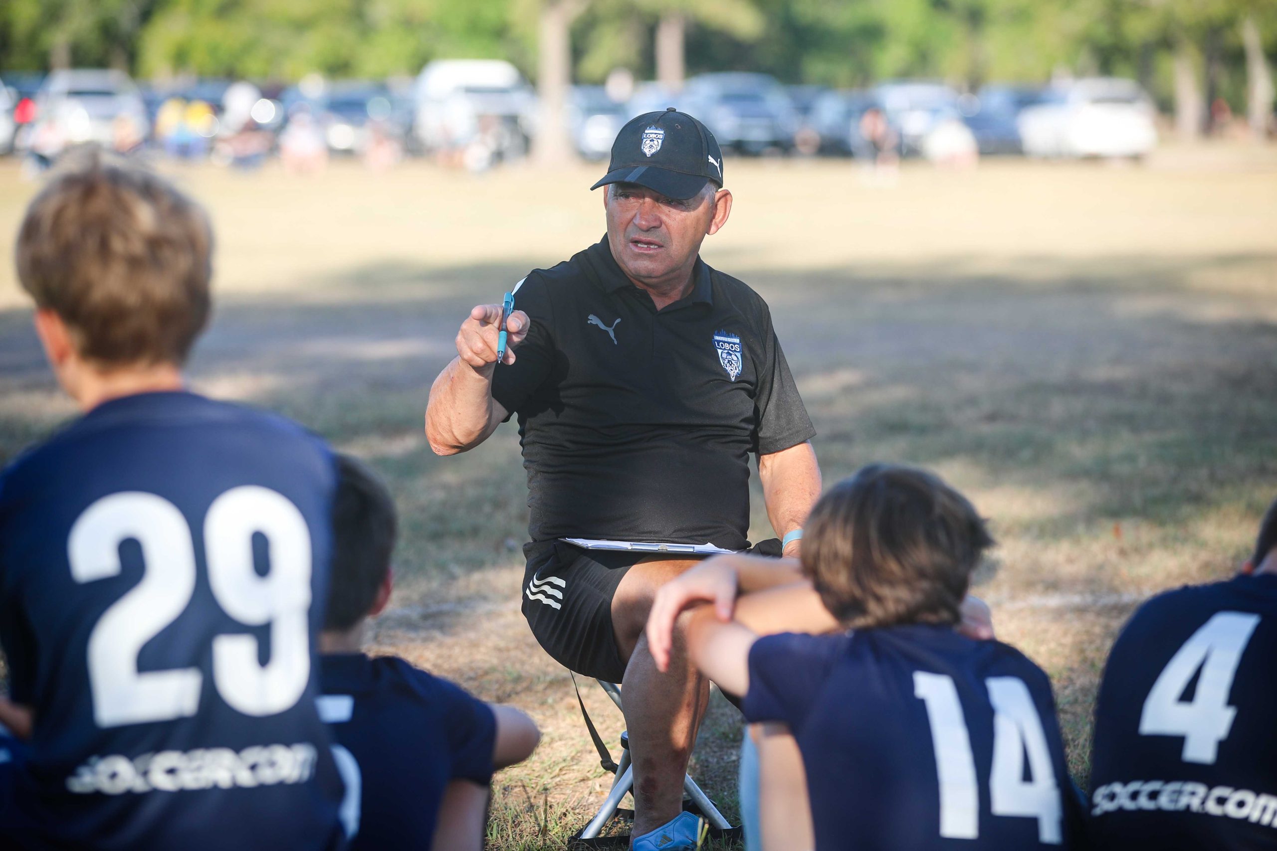 Coach instructing players