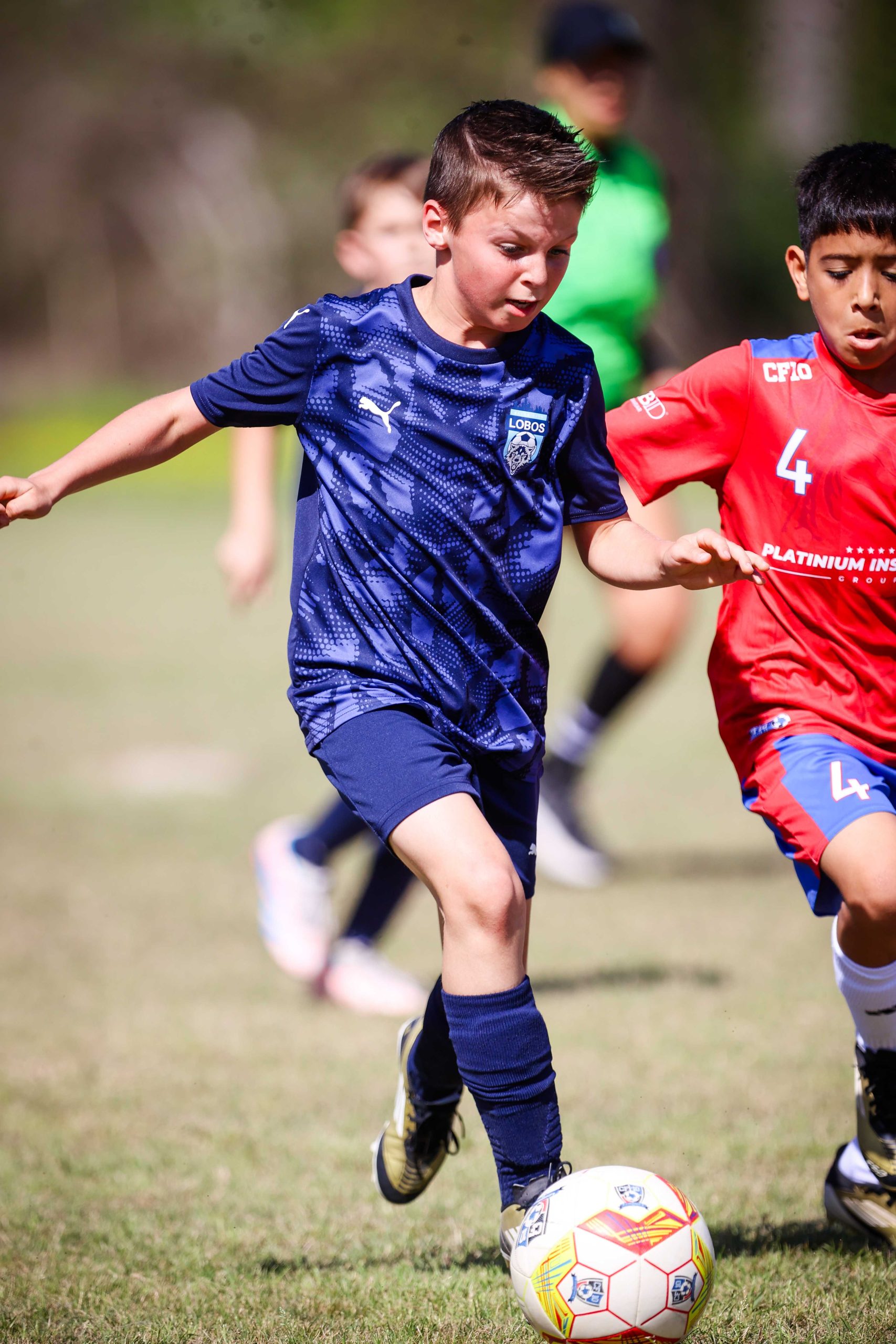 Player dribbling past opponent